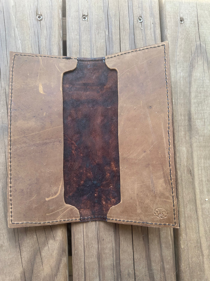 Hand tooled tally book.