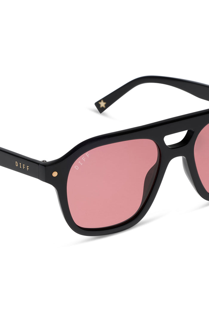 Black sunglasses with pink lenses on a white background