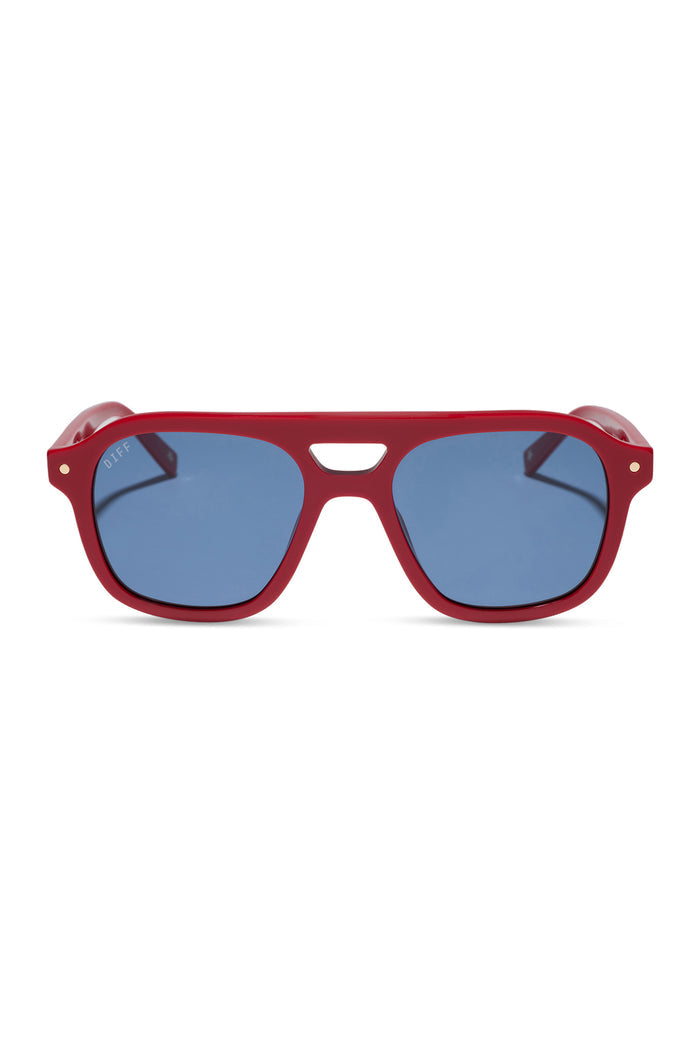 Red sunglasses with blue lenses on a white background