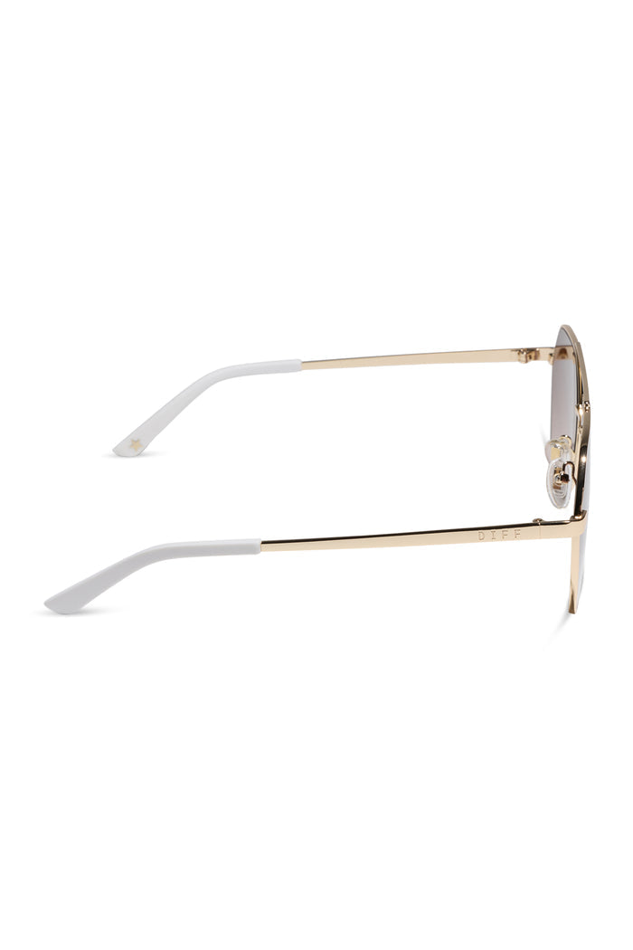 Sunglasses with gold frame and white arms on a white background