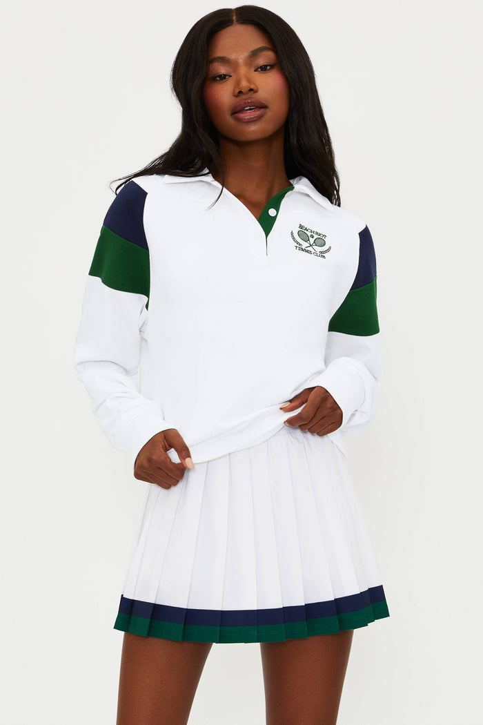 Woman wearing a white and green dress with a collar on a white background