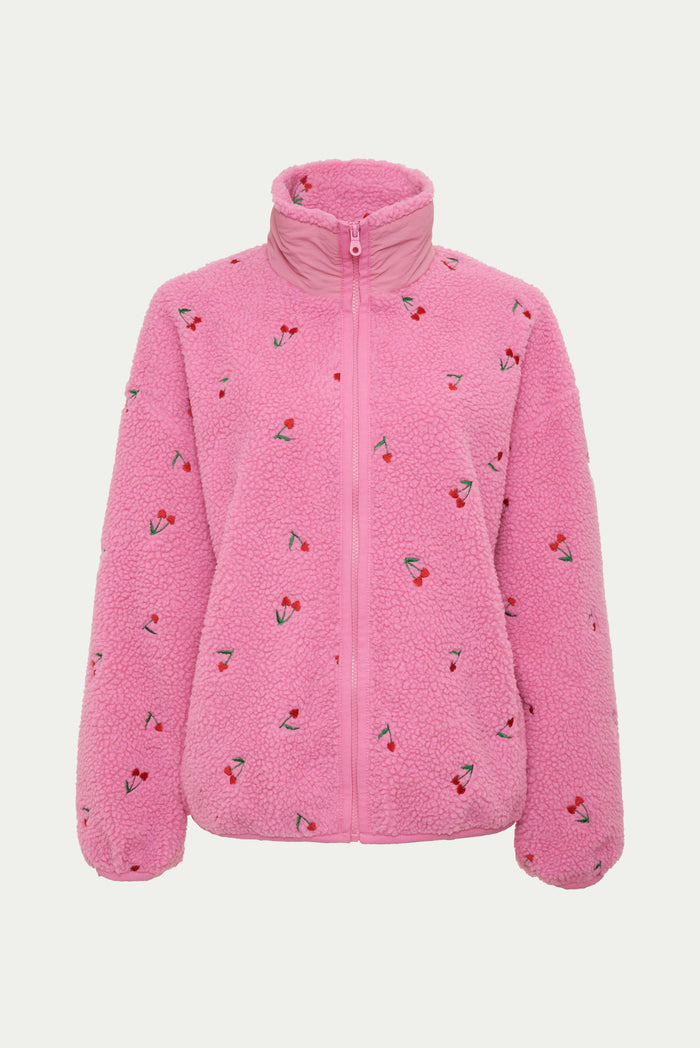 Pink sherpa with red cherries on it.