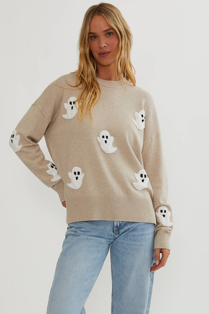 Oatmeal sweater with little white ghosts.