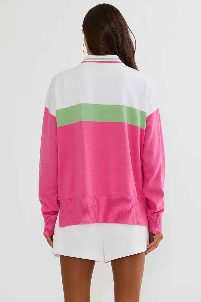 Woman wearing a colorful sweater with a white background