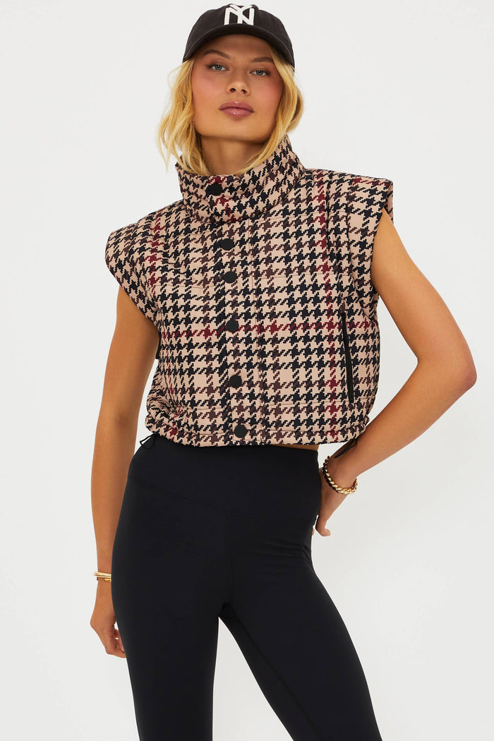 Woman wearing a houndstooth patterned outfit