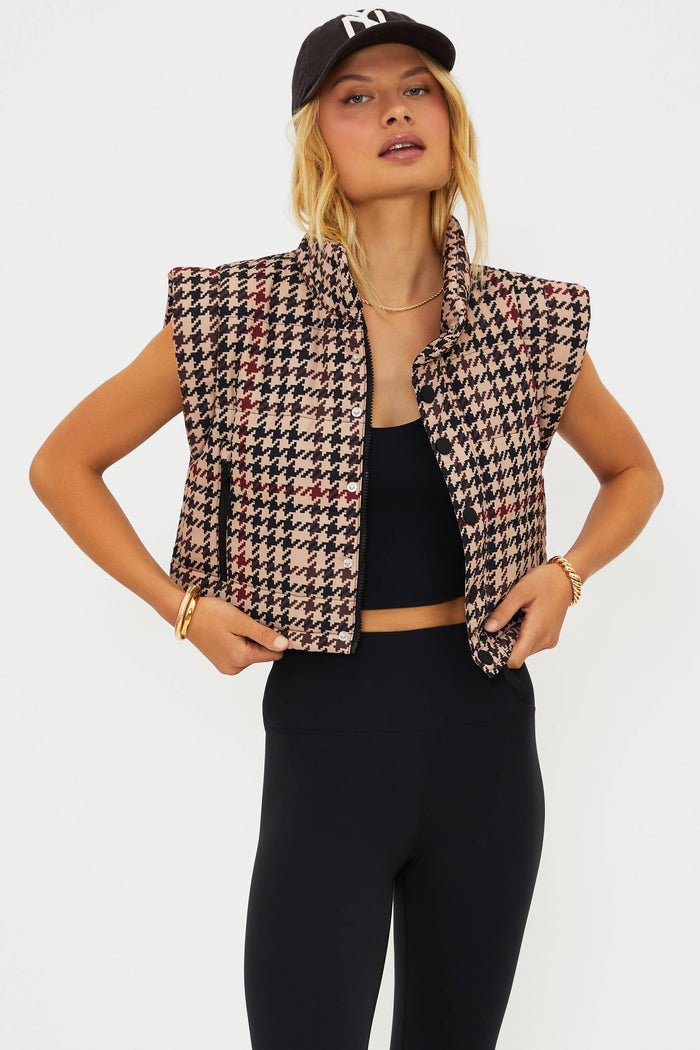 Woman wearing a houndstooth patterned outfit