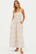 Woman wearing a floral dress on a white background