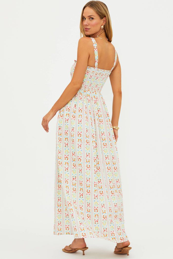 Woman wearing a floral dress on a white background