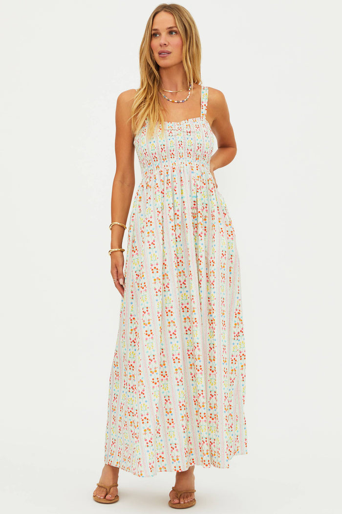 Woman wearing a floral dress on a white background