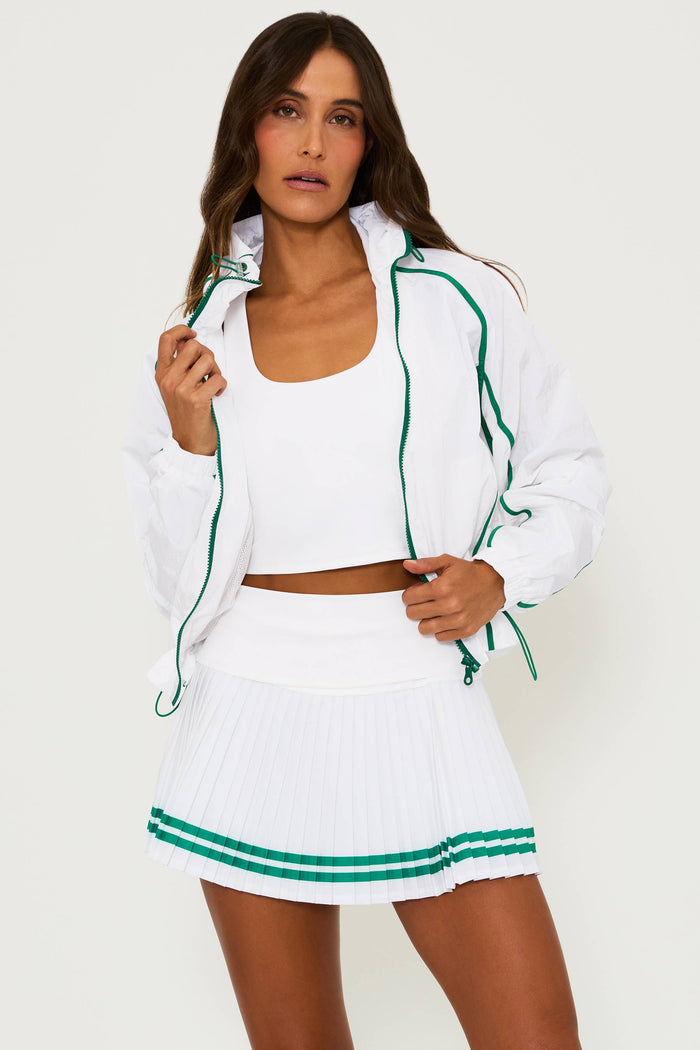 white running jacket with green piping detail