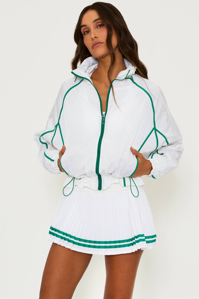 white running jacket with green piping detail