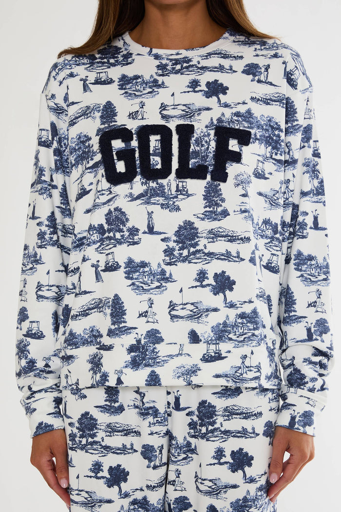 Long-sleeve shirt with 'GOLF' text and blue pattern on white background