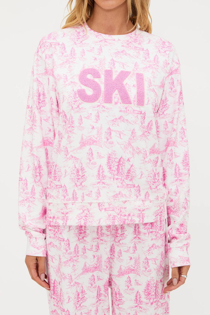 Pink and white tie-dye sweatshirt with 'SKI' text on a white background