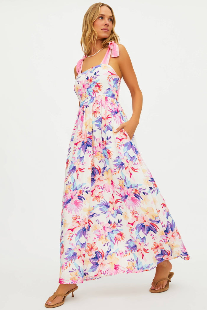 Woman wearing a colorful floral dress on a white background