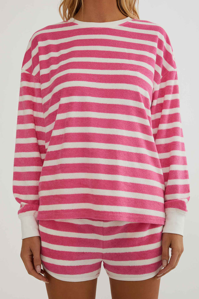 Pink and white striped long-sleeve top and shorts set on a plain background