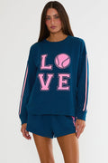Navy sweatshirt with "Love" tennis text in pink.