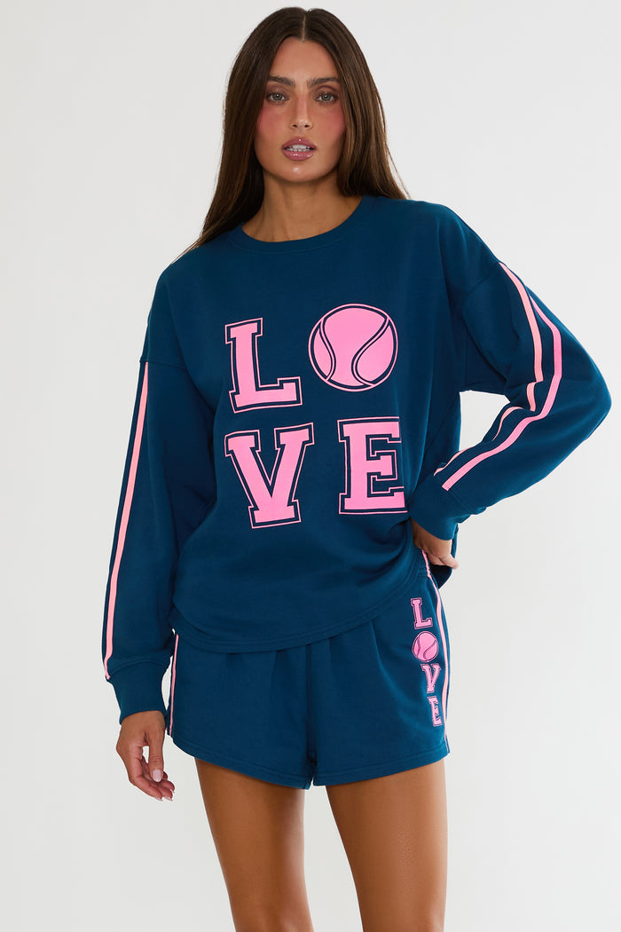 Navy sweatshirt with "Love" tennis text in pink.