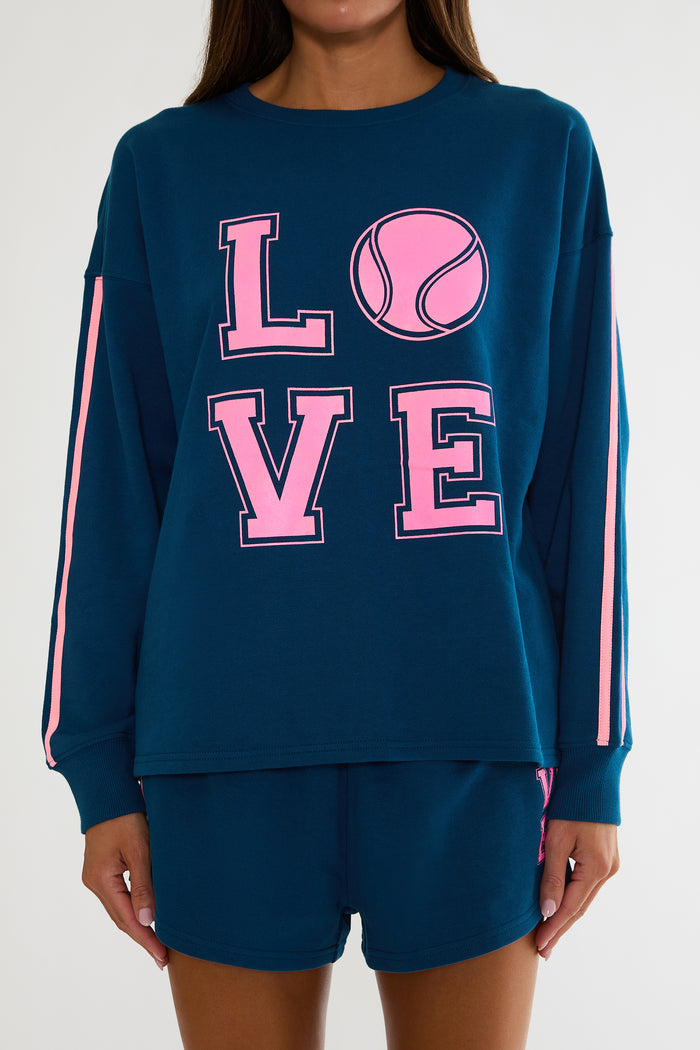 Navy sweatshirt with "Love" tennis text in pink.