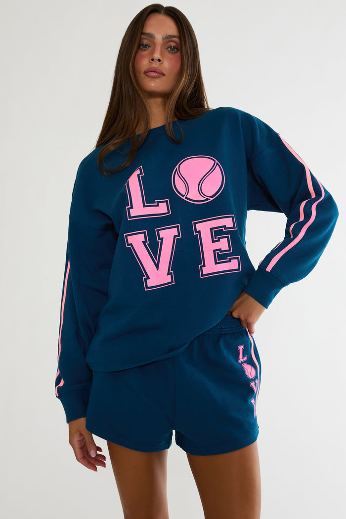 Navy sweatshirt with "Love" tennis text in pink.