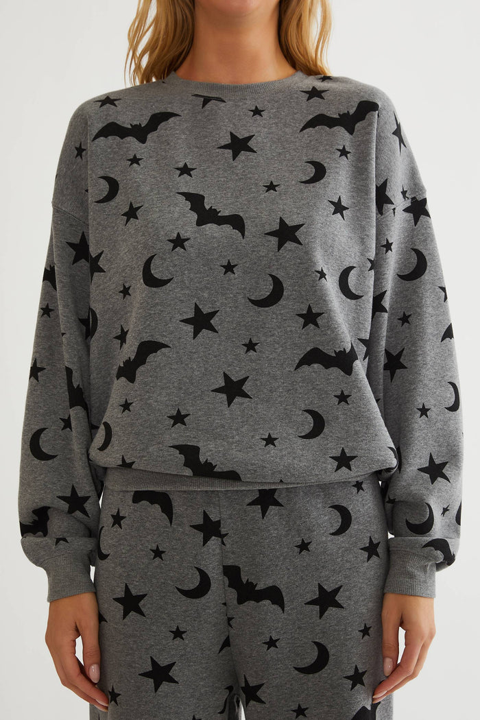 Grey oversized sweatshirt with black bats, stars, and moon.