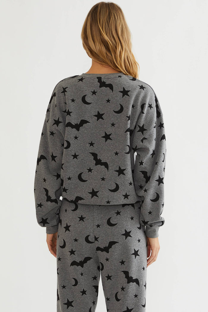 Grey oversized sweatshirt with black bats, stars, and moon.