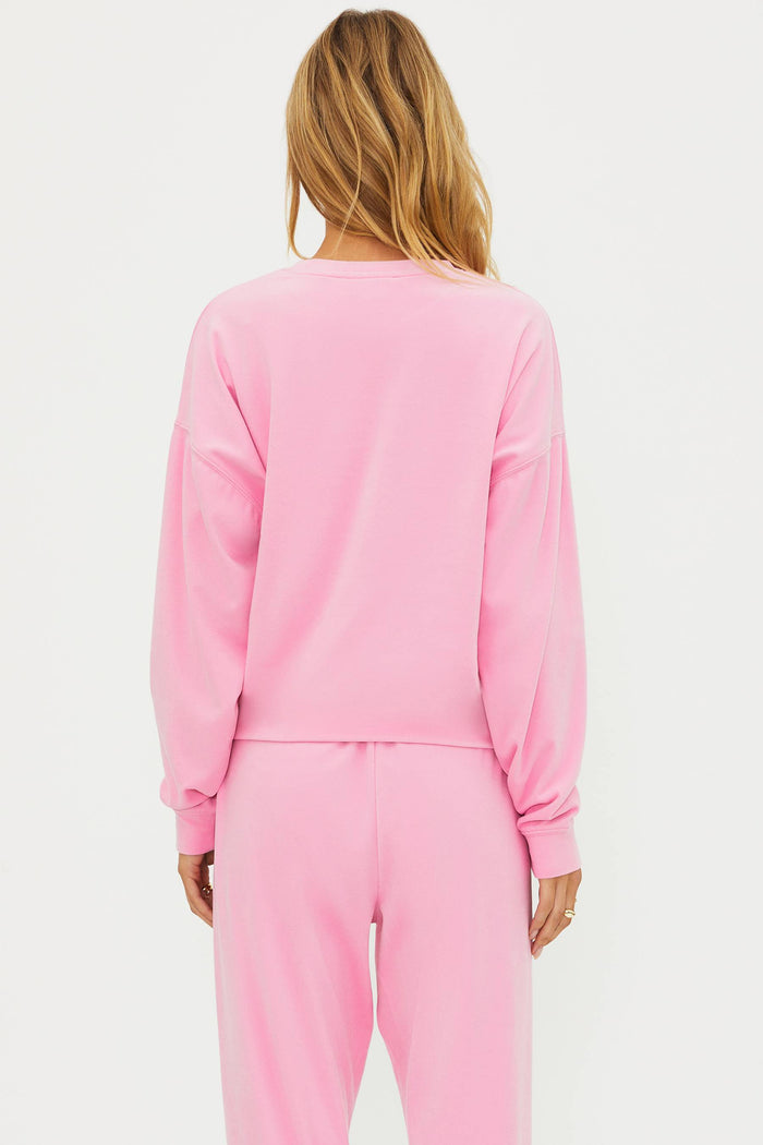 Pink sweatshirt with "be mine" in red sequin