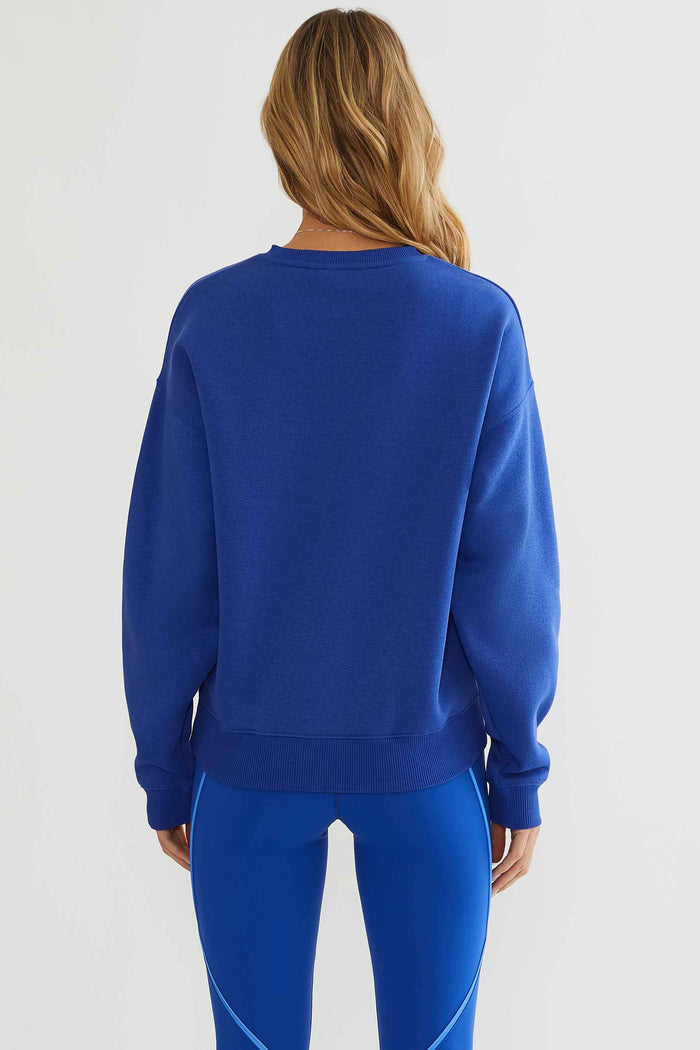 Royal blue sweatshirt with "matchpoint tennis club" text printed on the front.