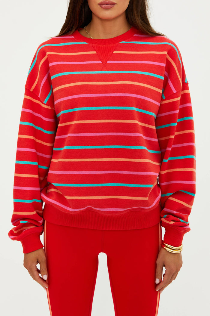 Person wearing a red striped sweater on a white background