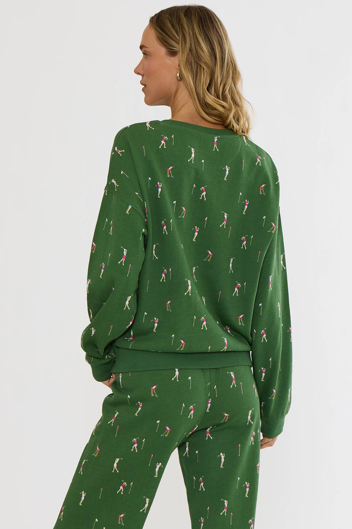 Woman wearing a green patterned outfit on a white background