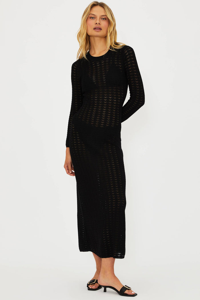 Woman wearing a black dress on a white background