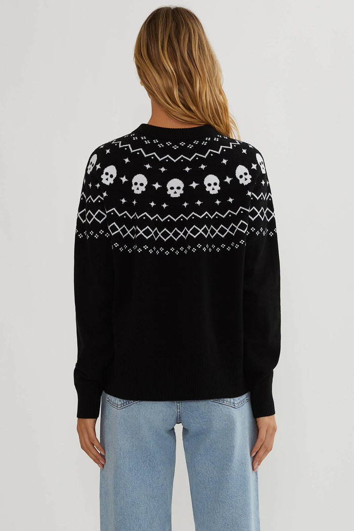 Black sweater with white detailing and white skulls.