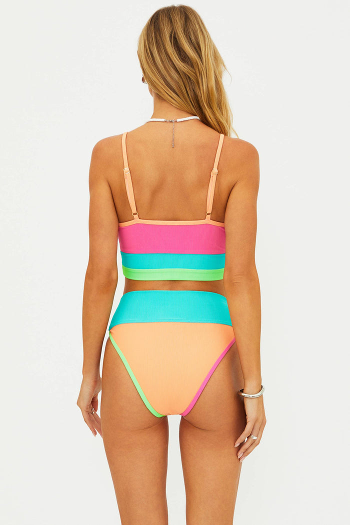 Multicolored bikini worn by a model on a white background
