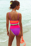 Teal, hot pink, purple, and orange highwaisted ribbed color block suit.