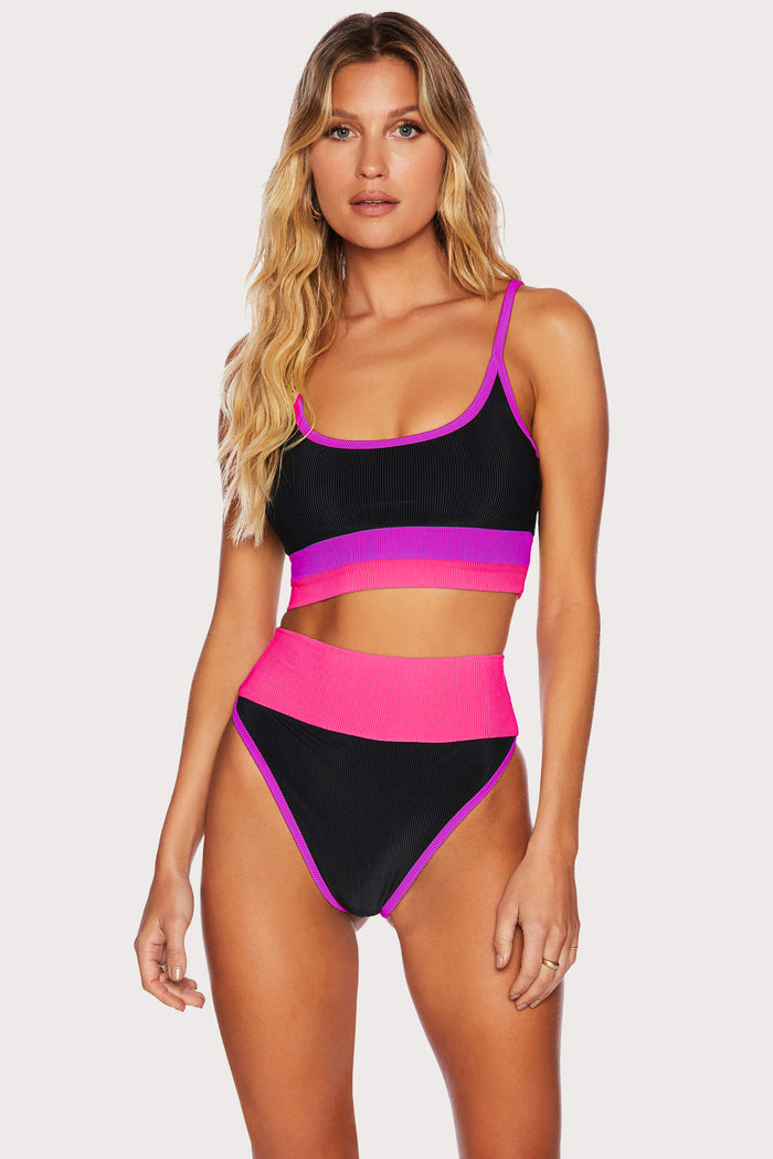 Pink, purple, and black high waisted ribbed bottoms.