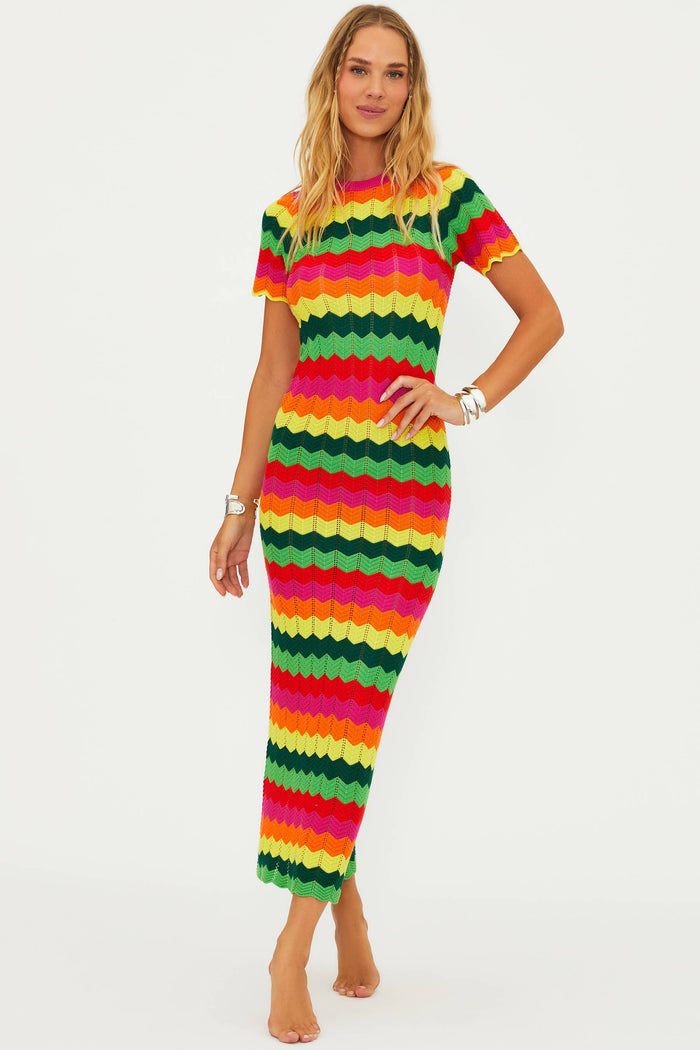 A model wearing a colorful striped maxi dress with cap sleeves.
