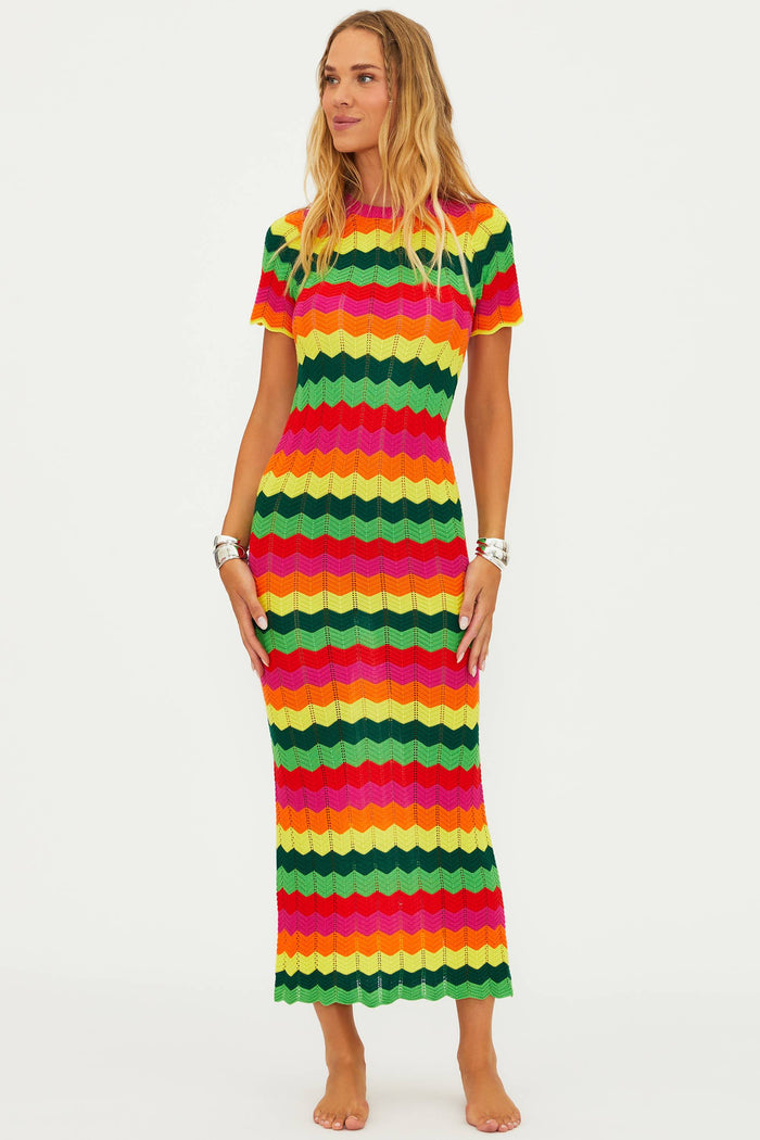 A model wearing a colorful striped maxi dress with cap sleeves.