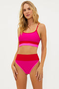high waisted swim bottom with pink and red color block detail and ribbed fabric