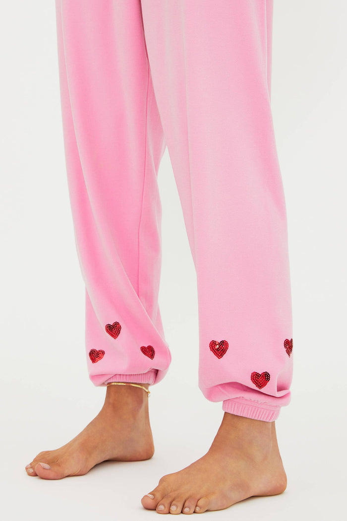 Pink sweat set with "be mine" in red sequins and red hearts around the ankles