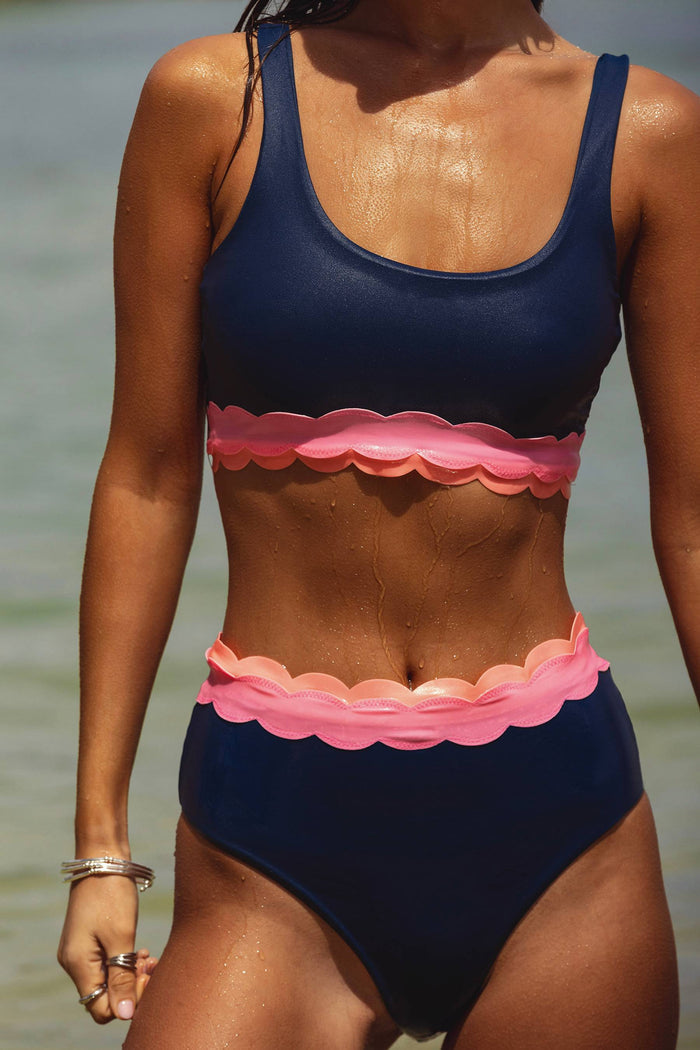 Navy high waisted bikini bottom with pink scalloping around the waist