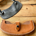 Leather sheath for a cheese knife.