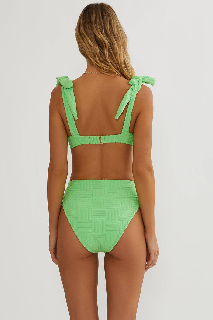 Green bikini set on a white background