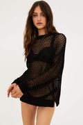 A female model wearing a black mesh long sleeve crew neck sweater.
