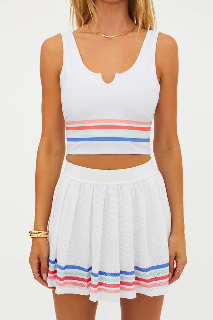 White sleeveless top and skirt with colorful stripes on a white background