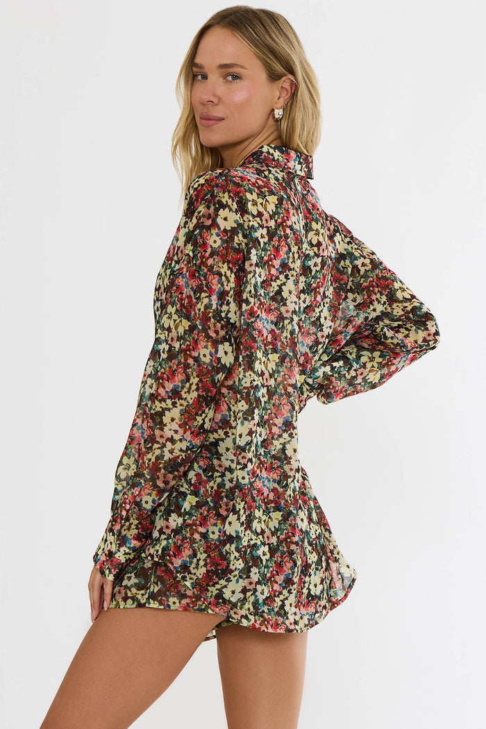 Woman wearing a floral dress on a white background