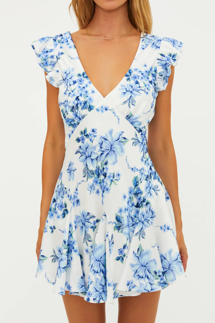 White dress with blue floral pattern on a white background