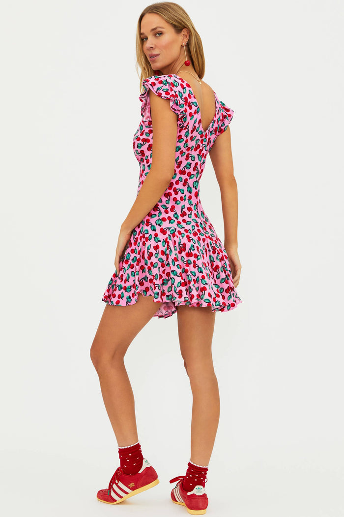 Pink dress with red cherries.