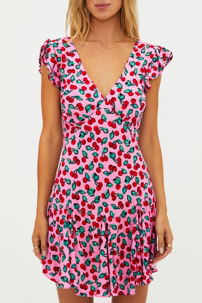 Pink dress with red cherries.