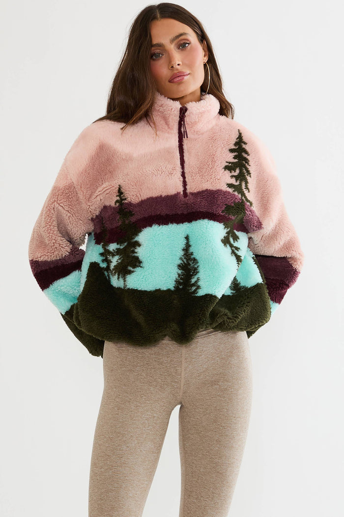 Quarter zip fuzzy jacket with colorful mountain print.