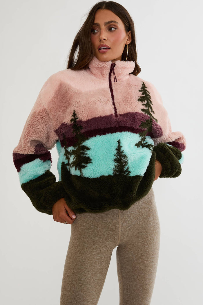 Quarter zip fuzzy jacket with colorful mountain print.