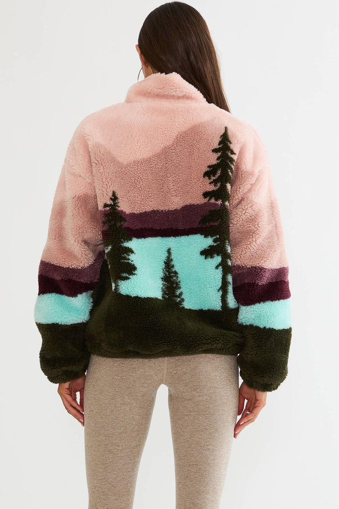 Quarter zip fuzzy jacket with colorful mountain print.